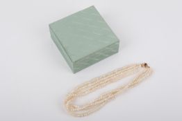 A four strand necklet of cultured freshwater pearls.