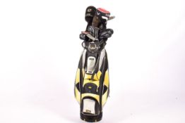 A Cobra golf bag with a set of assorted clubs.