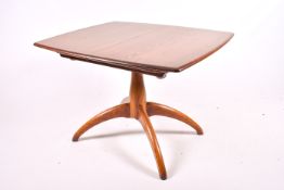 A contemporary elm Ercol dining table. Raised on central column and arched supports .