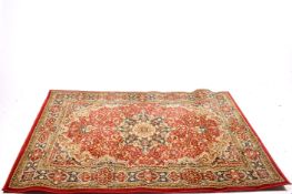 A modern Egyptian made 'Valby' rug on a red ground.