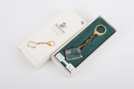 A gold plated Swarovski 'Crystal Memories' suitcase keyring, boxed.