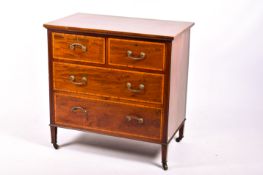 An Edwardian Drugh & Co inlaid mahogany chest of drawers.