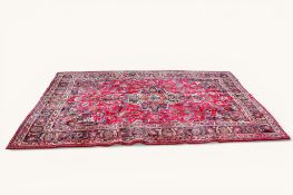 A 20th century Persian Mashad rug.