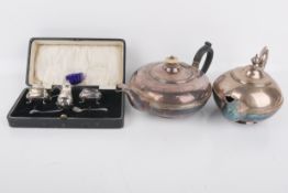 Two silverplated teapots and a silverplated cruet set.