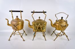 A collection of Victorian brassware. Including two kettles on stands, a kettle and a stand.