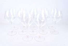 A set of twelve Riedel Restaurant Poppy Pinot Noir wine glasses.