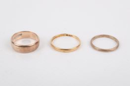 Three gold band rings. Two hallmarked 9ct, one with rubbed marks, various sizes, gross weight 6.8g.