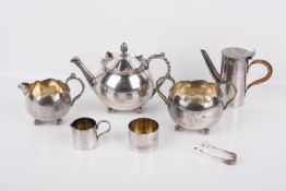 Two silverplated tea services containing a teapot, sugar bowl and cream jug.