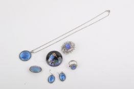 A small group of silver and white metal butterfly wing jewellery.