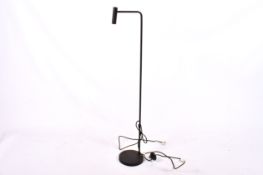 A contemporary black metal standard lamp.