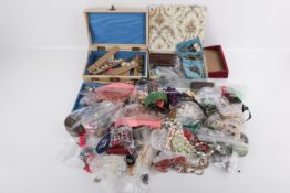 A large quantity of costume jewellery and jewellery boxes.