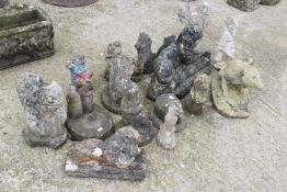 A collection of assorted reconstituted stone garden ornaments.
