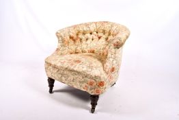 A 20th century button back tub chair.