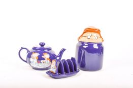 A collection of three Wade Tetley Tea Folk pottery items. Including a teapot, etc.