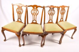 A set of four 19th century mahogany Chippendale style dining chairs with drop in seats.