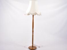 A vintage oak standard lamp.