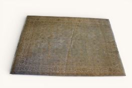 A large rug featuring intricate traditional patterns in soft muted tones.