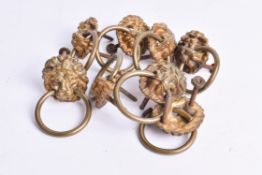 A collection of brass furniture ring handles. Modelled as lion masks, Diameter 4.5cm.