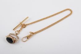 A 9ct gold fob attached to a gold plated chain.