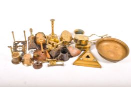A collection of assorted brass items. Including a trivet, four pestles and mortars, etc.