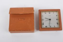 A Mappin & Webb Luxor travel alarm clock.