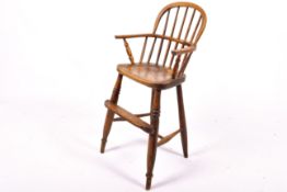A vintage oak high chair.