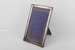 A Sterling silver easel back picture frame.