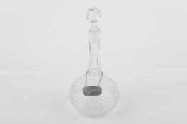 A Victorian glass shaft and globe decanter with silver sherry wine label.