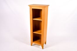Modern solid light oak slender open bookcase.