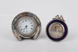 A Victorian silver mounted horseshoe design clock and a picture frame.
