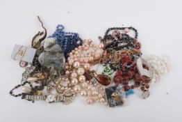 A collection of costume jewellery and wristwatches.