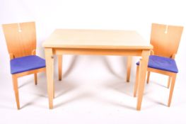 A contemporary 'Englender Furniture Ltd' dining table and two chairs.