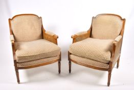 Pair of 20th century caned Bergere style armchairs.