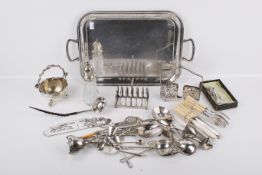 A small group of silverplated items.