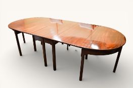 A George III mahogany extendable dining table.