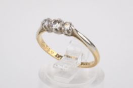 An 18ct gold three stone diamond ring.