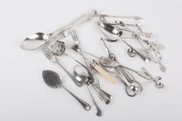 A small group of silver and silverplated flatware.
