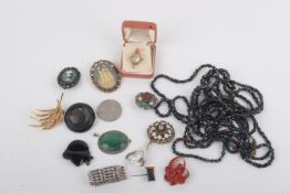 A collection of costume jewellery. Including a silver gate bracelet with a heart shaped locket, 17.