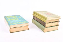 A collection of six assorted books.