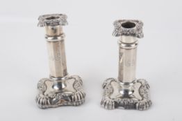 A pair of Victorian silver weighted candlesticks.
