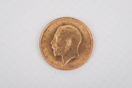 A 1913 half sovereign coin.