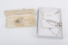 Two necklaces and a pair of earrings.