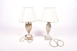 A pair of contemporary table lamps in the form of an urn.