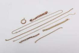 A group of gold and yellow metal jewellery.