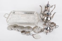 A group of silverplated table items.