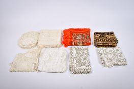 A collection of assorted vintage table linen. Including lace table cloths, lace doilies, etc.