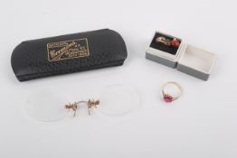 A small group of gold and yellow metal items.