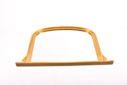 An arched gilt framed overmantel mirror. Total H84cm x W127cm.