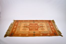 A modern Kilim rug with a red ground.