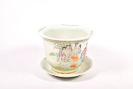 A large 20th century Chinese ceramic pot and stand. Decorated with figures in the landscape.